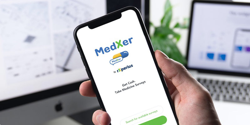 Photo of person holding smart phone with MedXer app on screen